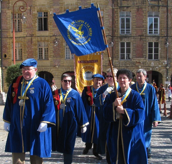 Ambassadors of Rabbit in Beer parading in front of the Brotherhood of Cacasse à cul-nu - lovers during the Festival des Confréries, Charleville-Mézières. GLK.