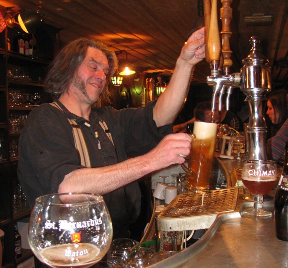 Philippe Boudart behind the bar on his barge Le Mawhot, Charlesville-Mézières. GLK.