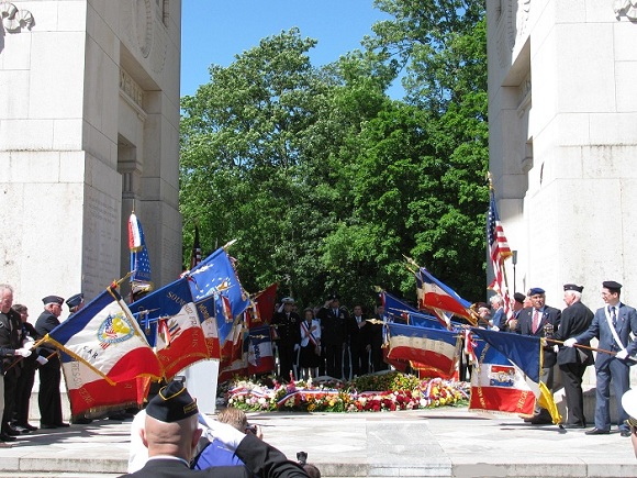 Lowering of the flags during the playing of the American Taps and the French Sonnerie aux mort on Memorial Day. Photo GLK.