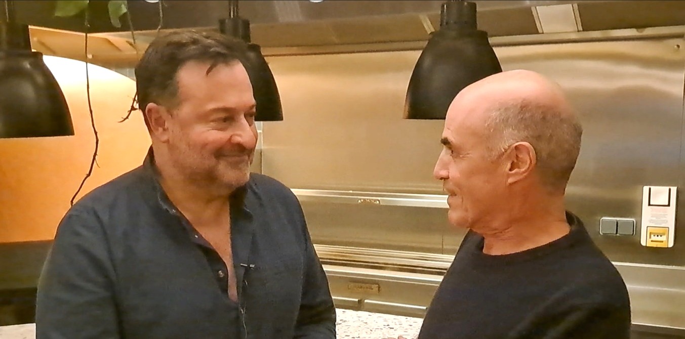 Gary Lee Kraut, right, interviews Jean-Philippe Daguerre, left.