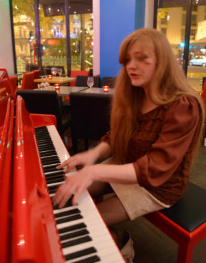 Svetlana at the red piano at Ikra.