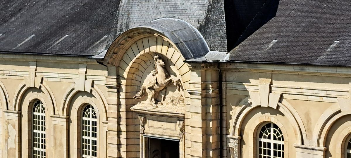 Entrance to the stables at La Roche-Guyon as seen from the terrace of the chateau. Photo (c) GLK.
