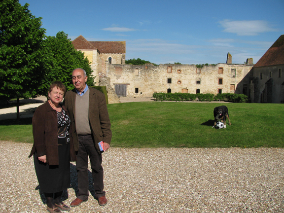 M. and Mme. Mongeot and dog by the Abbey de Fontmorigny.