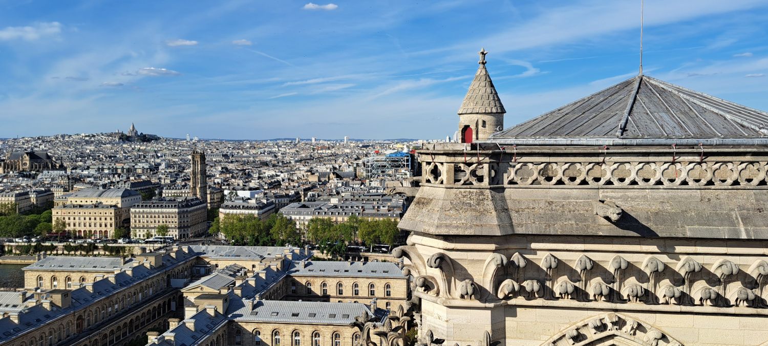 The towers of Notre-Dame de Paris. View from the south tower to the north tower and beyond to Sacré Coeur Basilica. Photo GLK.